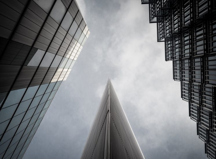 Looking up at three buildings in Moore London on the south bank of the River Thames