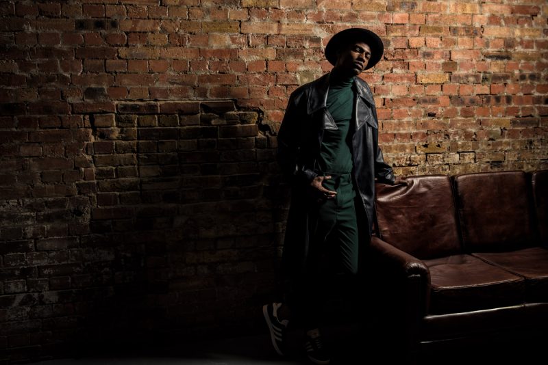 Fashion photograph, one man in hat and leather jacket