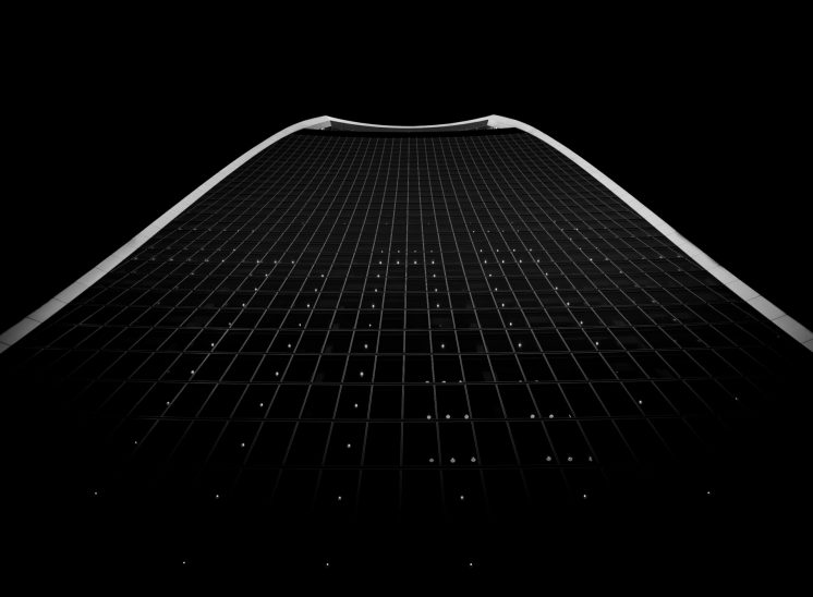 Looking up at the Walkie Talkie building in black and white