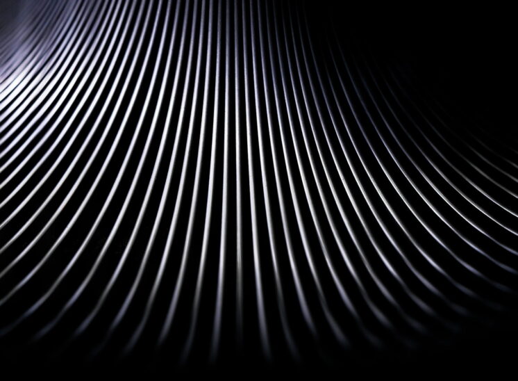 Black and white, high contrast, close up abstract of toy Slinky spring