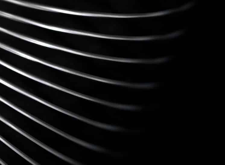 Black and white, high contrast, close up abstract of toy Slinky spring