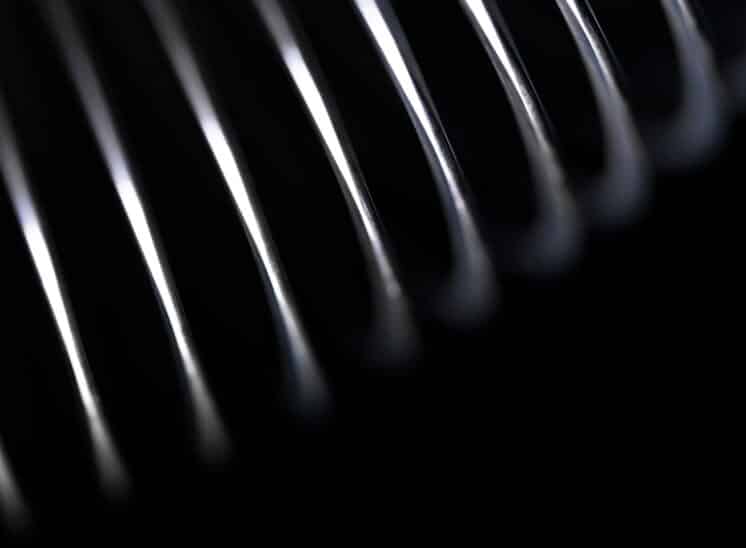 Black and white, high contrast, close up abstract of toy Slinky spring