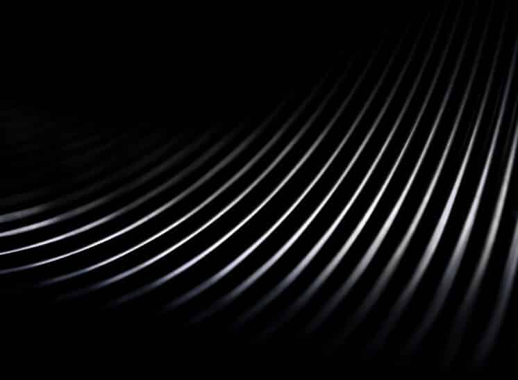 Black and white, high contrast, close up abstract of toy Slinky spring