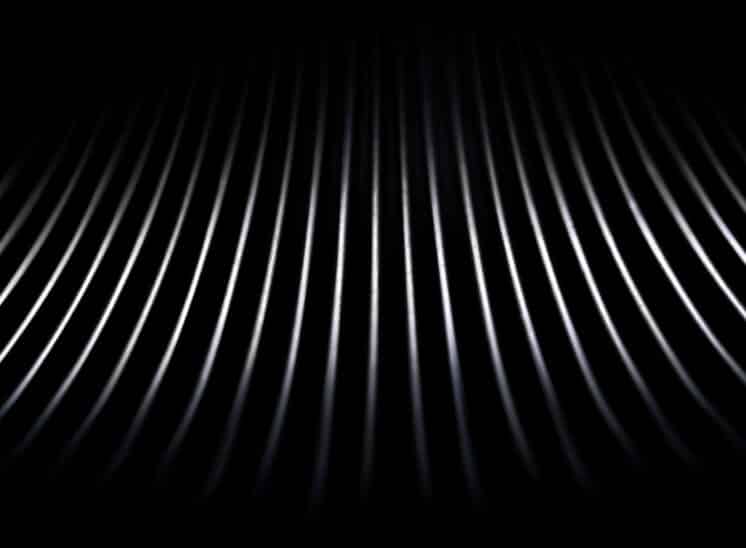 Black and white, high contrast, close up abstract of toy Slinky spring