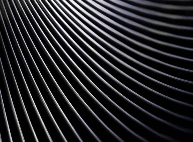 Black and white, high contrast, close up abstract of toy Slinky spring