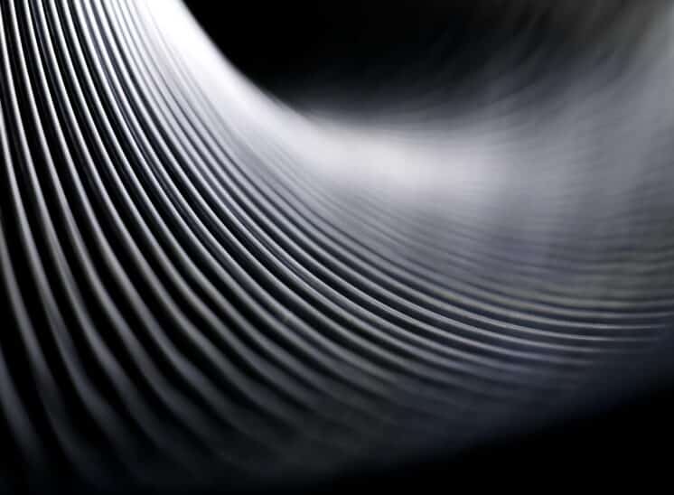 Black and white, high contrast, close up abstract of toy Slinky spring